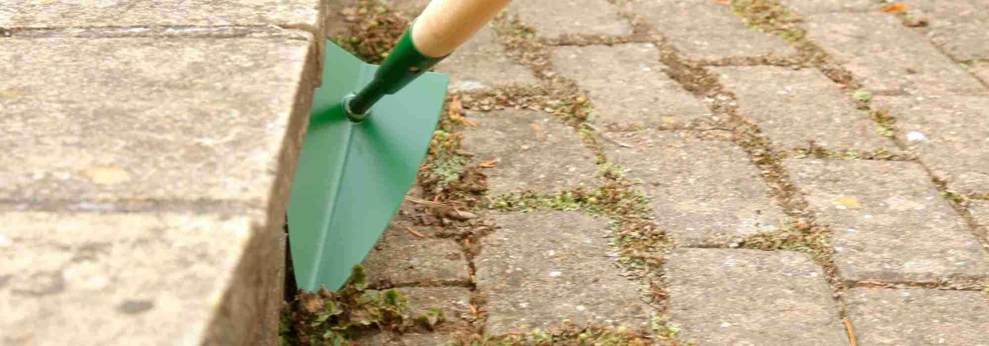 What is a hand weeder used for?